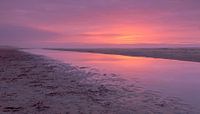 Zonsondergang op het strand van Koos de Wit thumbnail