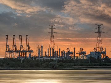 Heavy industry during an orange colored sunset_2 by Tony Vingerhoets
