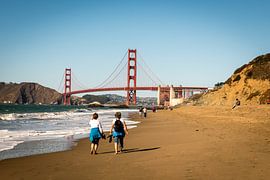 Golden Gate Bridge in San Francisco California from Baker Beach with tourists