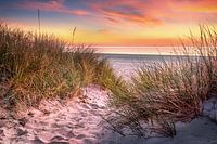 Beach at the Baltic Sea in the warm sunrise