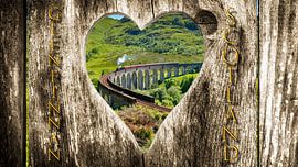 View of Glenfinnan Viaduct in Scotland through a wooden heart by Jürgen Wiesler