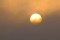 Sun rises over morning fog