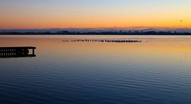 Sunset at the lake by Marjo Dekker