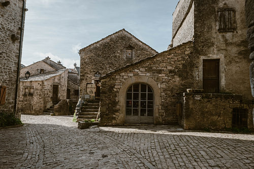 Medieval stone village square with cobblestones in southern France