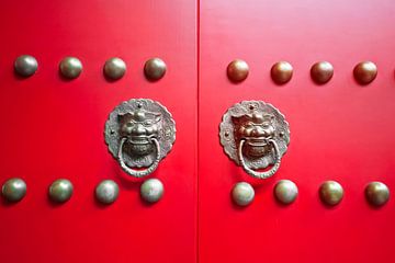 Classic Chinese red gate with copper door knockers by Chihong