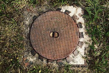 Afsluitdeksel in gras