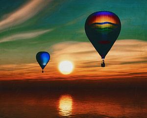 Hot air balloons sail over the sea