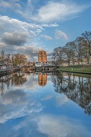 The Oldehove in Leeuwarden mirrored in the city canal by Harrie Muis