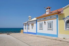 Colourful houses on the coast in Ericeira, Portugal by Lensw0rld