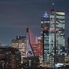 De Erasmusbrug in de kleur oranje in Rotterdam met de Zalmhaventoren en Maastoren (||) van MS Fotografie | Marc van der Stelt
