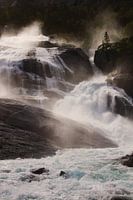 Sunlit waterfall in Norway