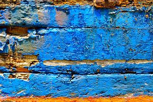 Old damaged paint on a boat stranded in port