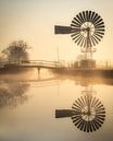 Weidumer mill mirrored in early morning fog by piet douma thumbnail