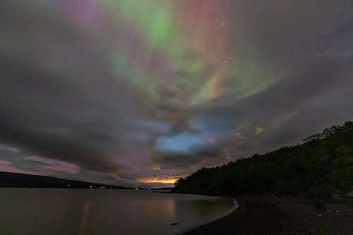 Northen light under mountains. Beautiful natural landscape in the Iceland