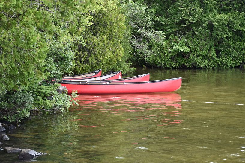 Kayaks on the lake by Claude Laprise