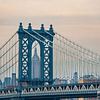 The Empire State Building framed by Manhattan Bridge by Carlos Charlez