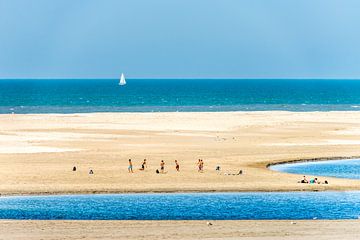Summer beach scene with boys playing football on the Sand Motor beach near Kijkduin. by John Duurkoop