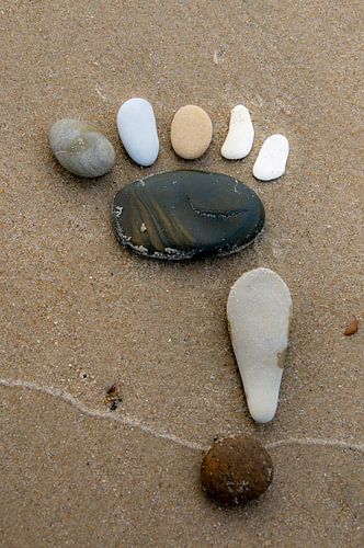 Stone footsteps on the beach.