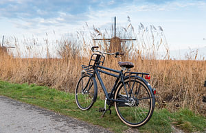 old type of bike and windmill