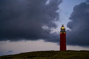 Texel lighthouse in the dunes during a stormy autumn evening