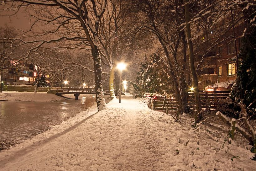 Snowy Amsterdam in winter by night by Eye on You