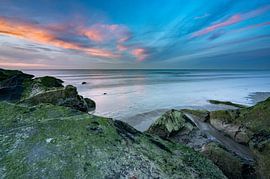 Impressive colours above a rocky outcrop by Michel Knikker