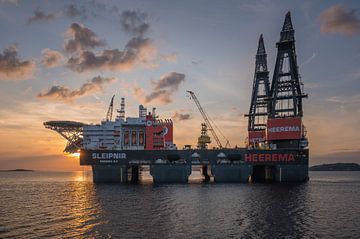 Crane ship Sleipnir with sunset by Jan Georg Meijer