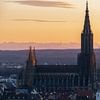 Ulm Cathedral and the city of Ulm in the evening at sunset with Alps in the background by Daniel Pahmeier