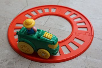 Toy train track with train on track