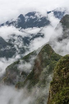 Clouds between the mountains by Joost Potma