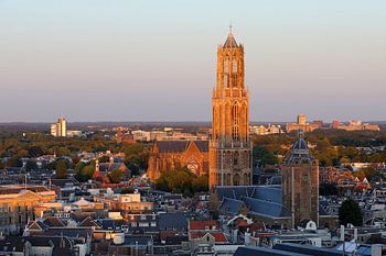 Cityscape of Utrecht with the Dom tower illuminated by the setting sun