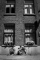 Vélo sur le mur d'une maison à Bruges
