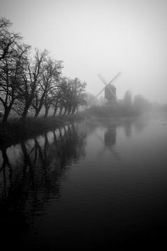 misty morning with a windmill