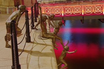 Children jump in the water by Martin de Hoog