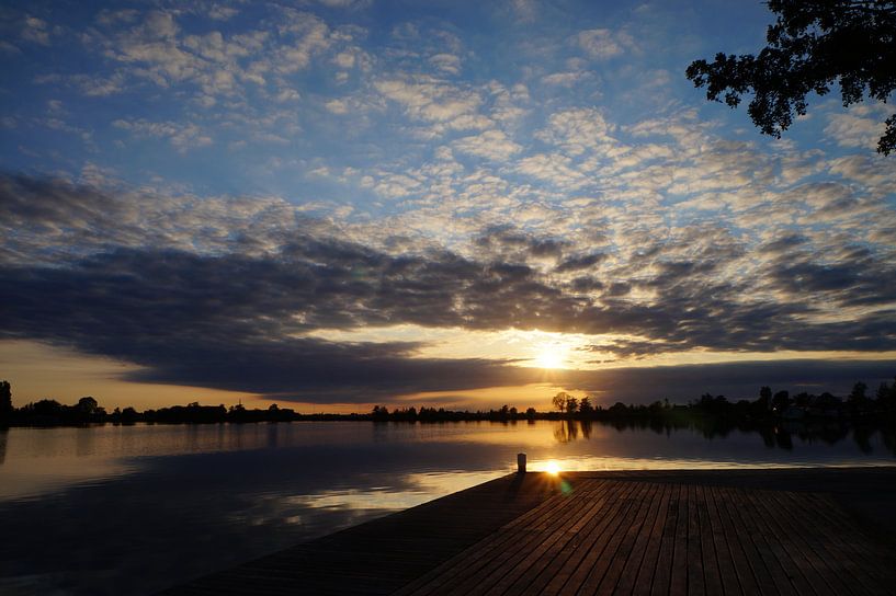 Sunset over the water by Martine Overkamp-Hovenga