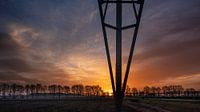 Sonnenaufgang mit Hochspannungsmast