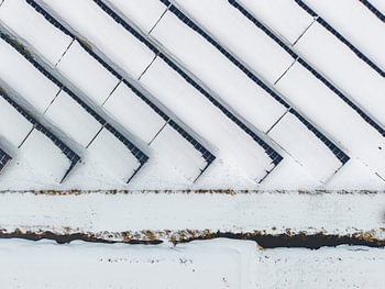 Solar panels under a blanket of snow