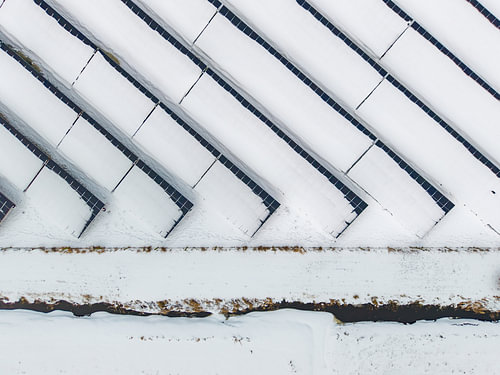 Solar panels under a blanket of snow
