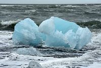 Blue ice wave breaker at glacier lagoon Jokulsarlon, Iceland