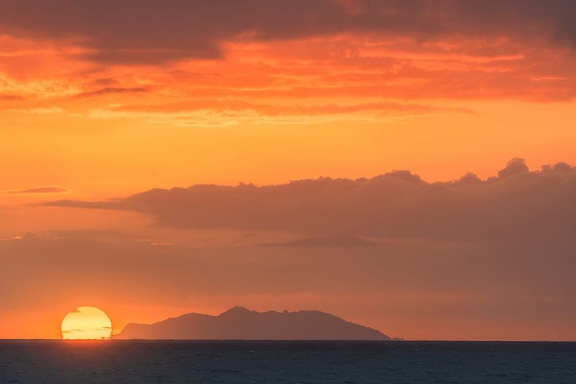 Gorgona island and setting sun view from Tuscan coast by Stefano Orazzini