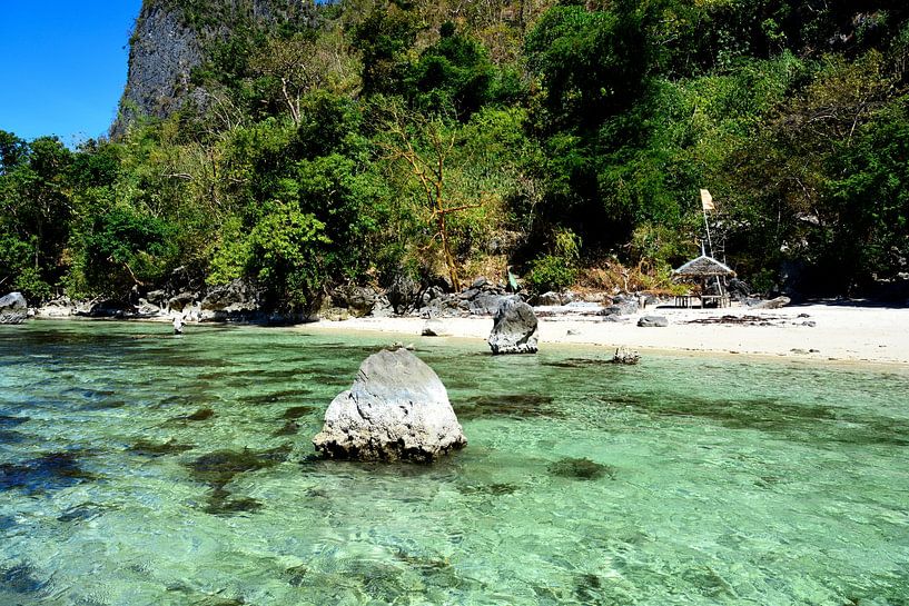 Wild beach and crystal-clear waters at Coron by Frank Photos