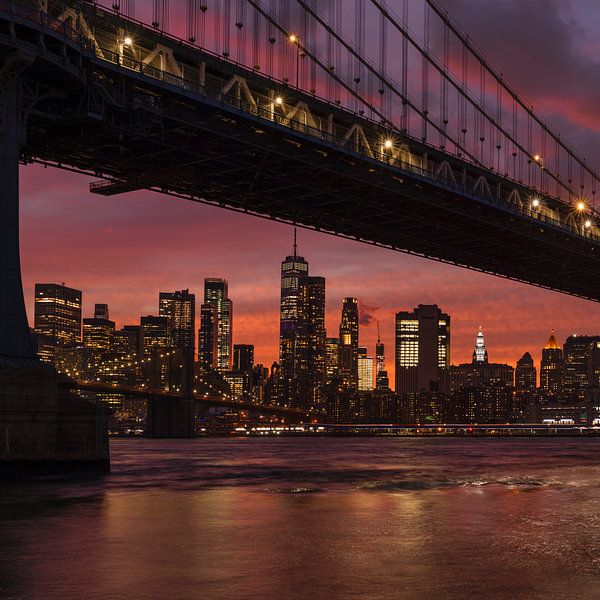 Skyline of Manhattan and Manhattan Bridge at sunset, New York, USA by Markus Lange