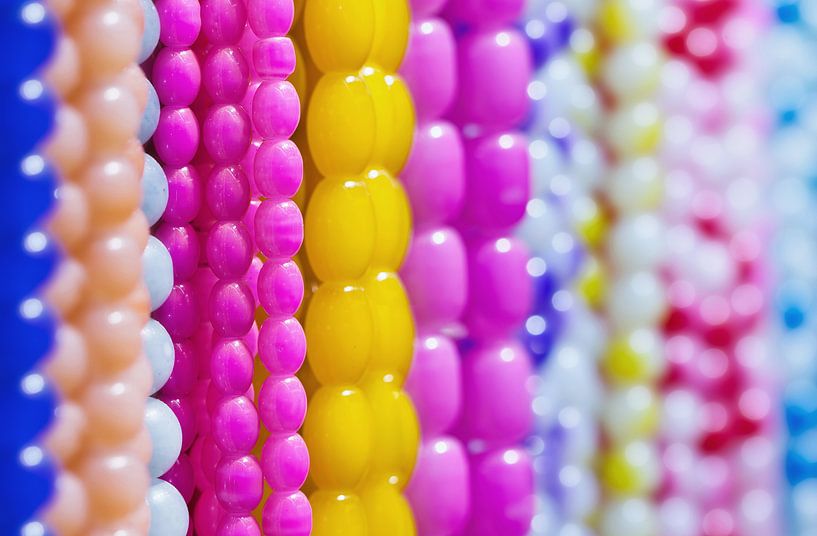 close-up of strings with sugary multicolored beads by Tony Vingerhoets