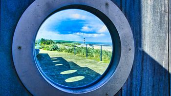 A view through a porthole of the Breskens lighthouse
