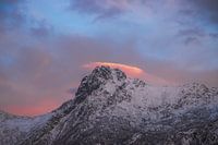 Pastel skies above snowy mountaintops