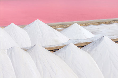 White mountains of salt by the pink waters of Bonaire