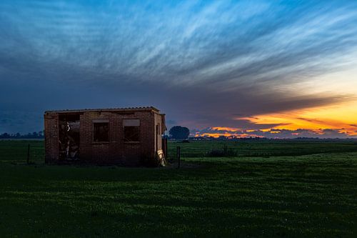 Dilapidated shed at sunset