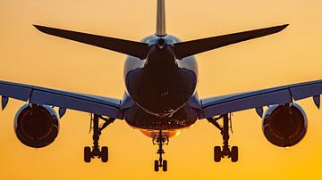 Airplane lands with sunrise by Dennis Dieleman