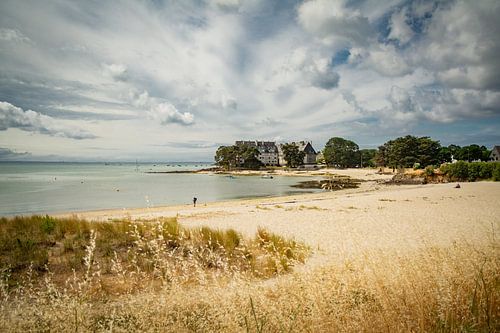 Picturesque cottages on golden beach in Brittany