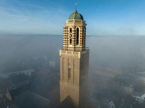 Peperbus church tower in Zwolle above the mist